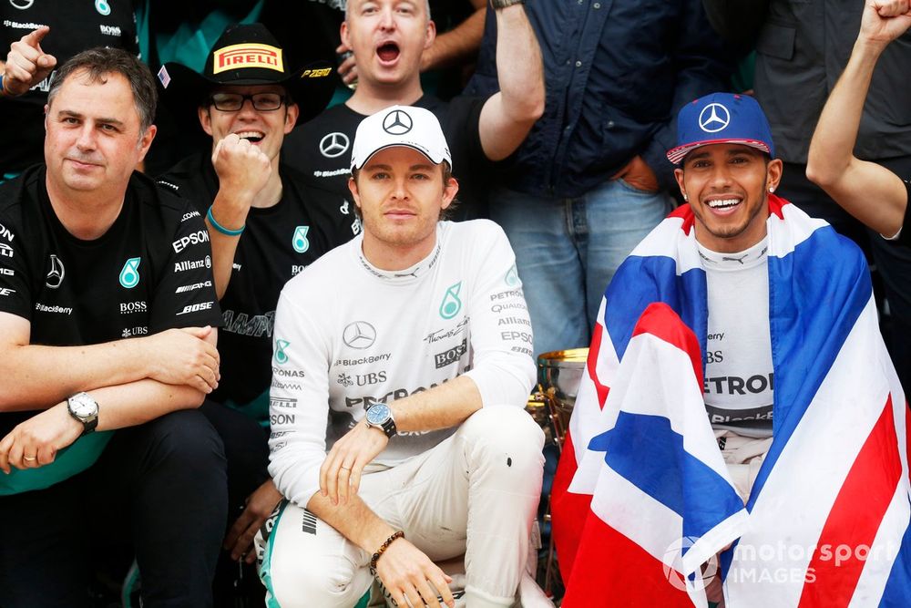 Nico Rosberg, Mercedes AMG, 2nd Position, and Lewis Hamilton, Mercedes AMG, 1st Position, celebrate with their team.