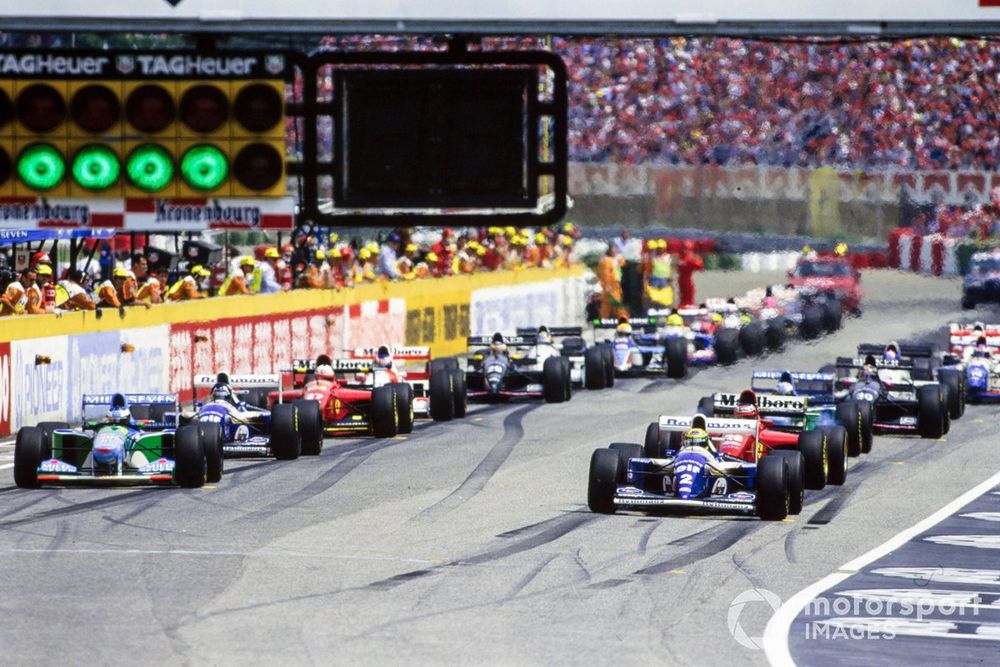 Cars on the grid ahead of the start. Ayrton Senna, Williams FW16 Renault, and Michael Schumacher, Benetton B194 Ford, make up the front row.