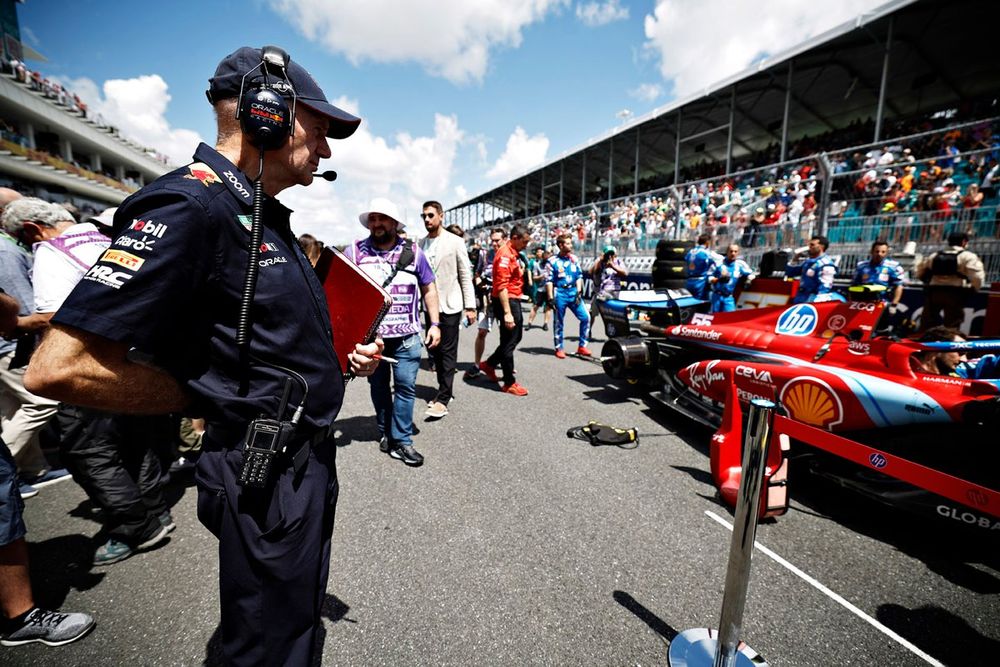 Adrian Newey, Chief Technology Officer, Red Bull Racing inspects the car of Charles Leclerc, Ferrari on the grid