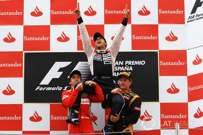 Podium: race winner Pastor Maldonado, Williams, second place Fernando Alonso, Ferrari, and third place Kimi Raikkonen, Lotus F1