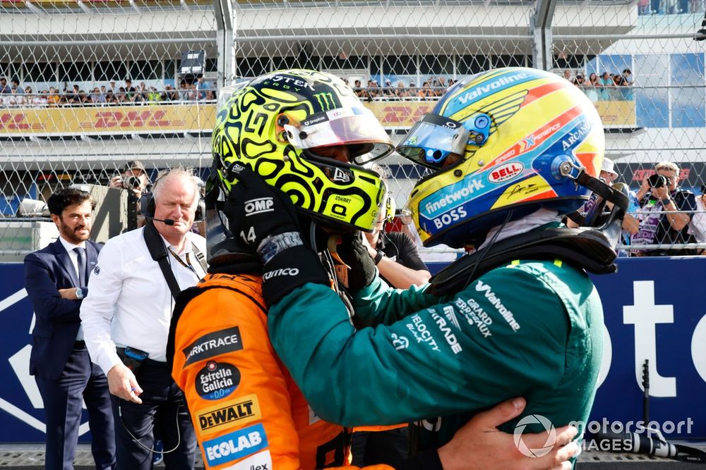 Fernando Alonso, Aston Martin F1 Team, embraces Lando Norris, McLaren F1 Team, 1st position, to congratulate him on his race win