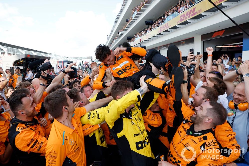 Lando Norris, McLaren F1 Team, 1st position, celebrates with a crowd pass by his team on arrival in Parc Ferme