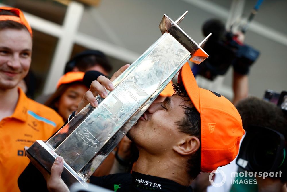 Lando Norris, McLaren F1 Team, 1st position, kisses the winners trophy
