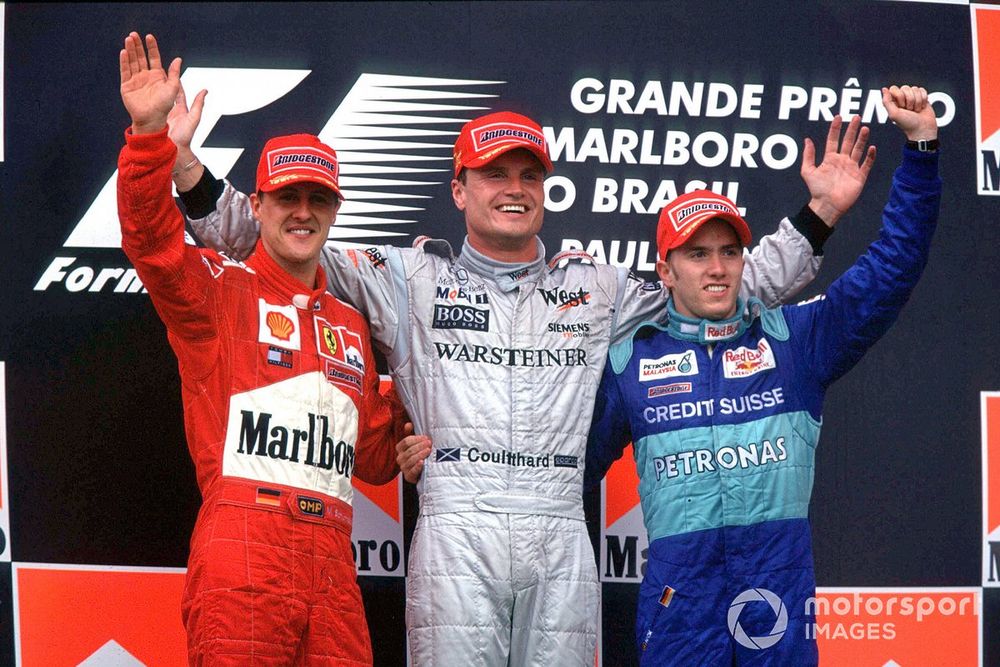 Podium: race winner David Coulthard, McLaren, second place Michael Schumacher, Ferrari, third place Nick Heidfeld, Sauber