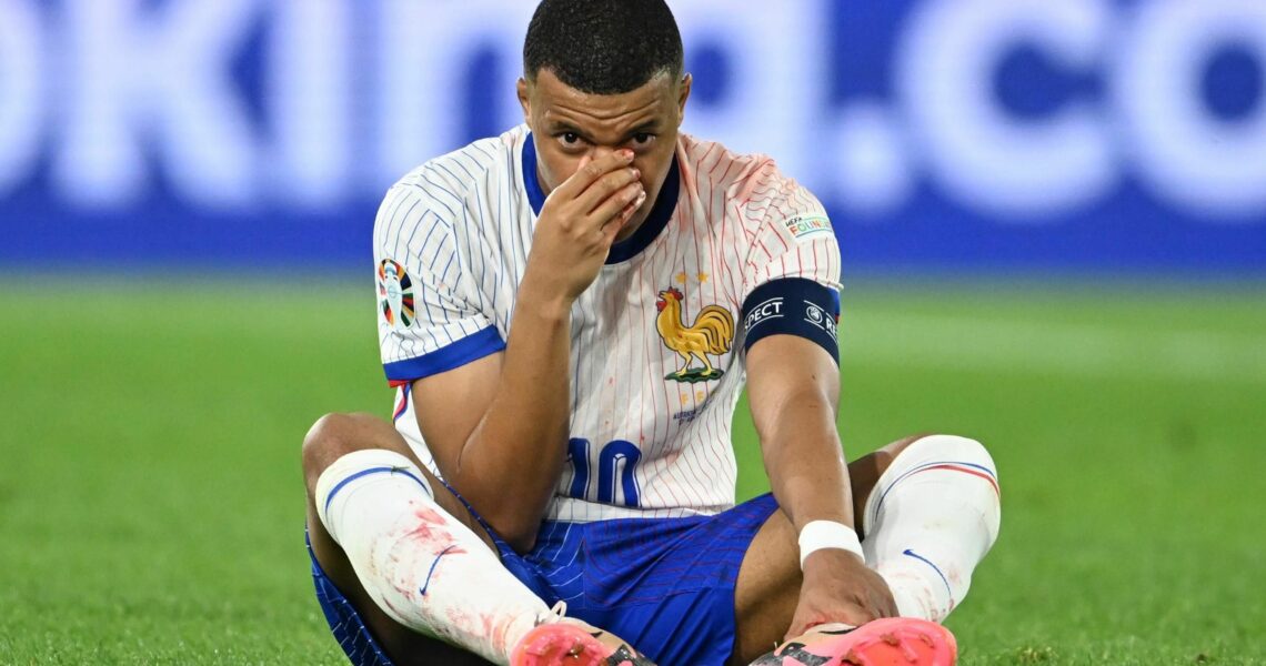 France sneak win as bloodied Mbappe comes off with busted nose
