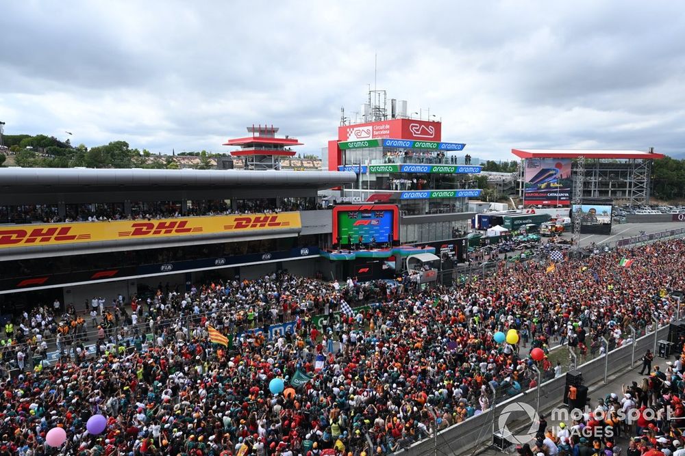 Fans invade the track to watch the Podium ceremony