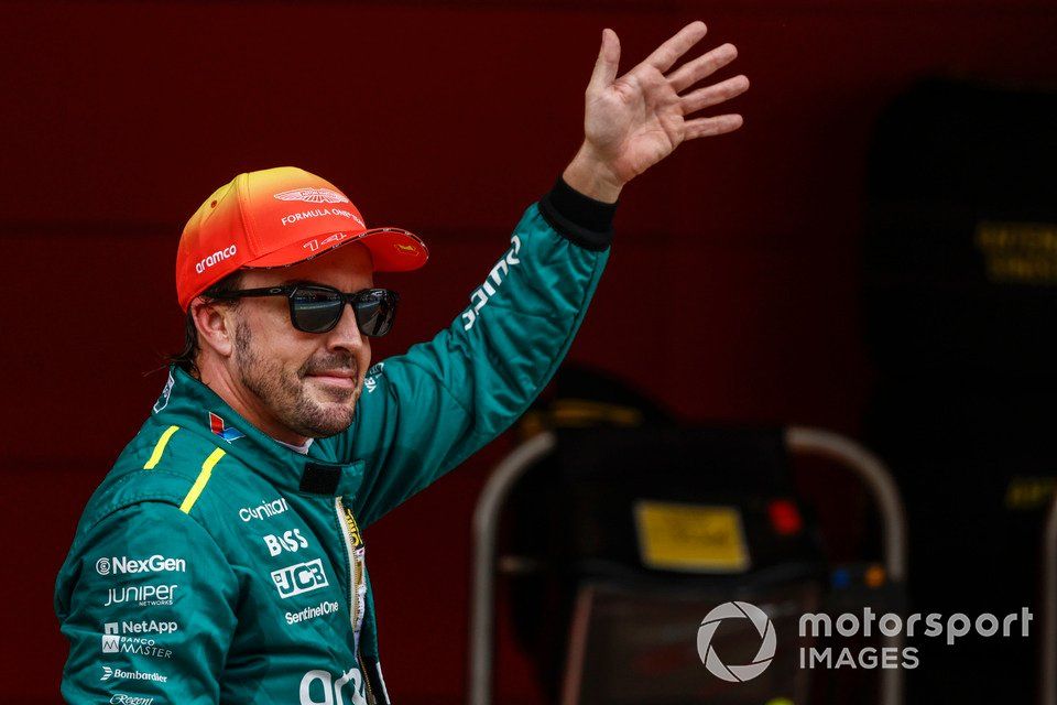 Fernando Alonso, Aston Martin F1 Team, waves to fans