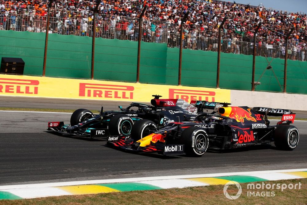 Max Verstappen, Red Bull Racing RB16B, battles with Lewis Hamilton, Mercedes W12