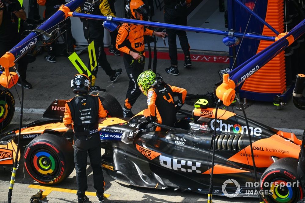Lando Norris, McLaren MCL38, retires in the pits after contact with Max Verstappen, Red Bull Racing RB20, whilst battling for the lead