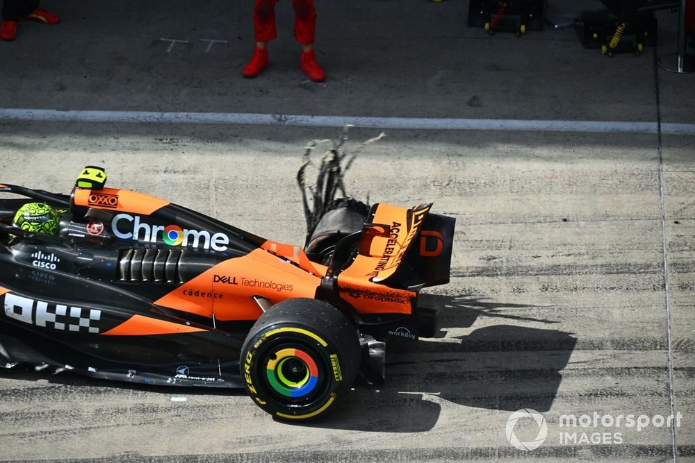 Lando Norris, McLaren MCL38, retires from the race with a rear puncture and damage after contact with Max Verstappen, Red Bull Racing RB20, whilst battling for the lead